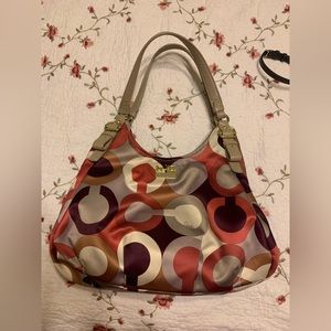 Coach purse handbag  Tan canvas with tan, purple and burgundy design